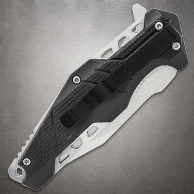 Folding knife with a black handle and metal clip