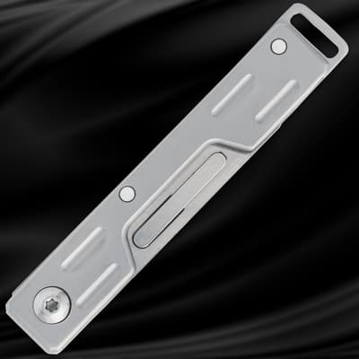 Closed silver folding knife on black background