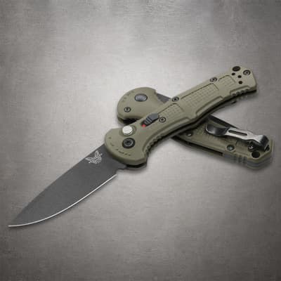 Two olive green folding knives, one open, one closed