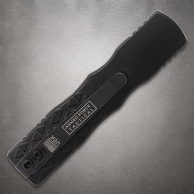 Back view of black tactical knife with pocket clip