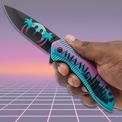 Hand holding a Miami-themed pocket knife
