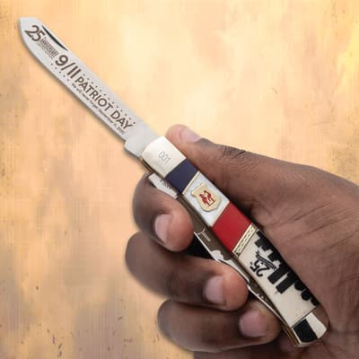 Hand holding a 9/11 Patriot Day commemorative knife