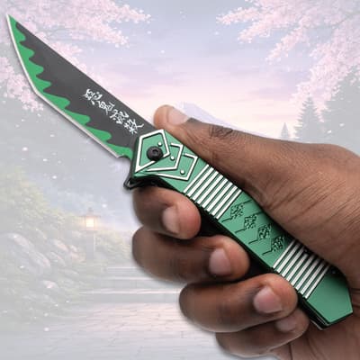 Hand holding green and black pocket knife