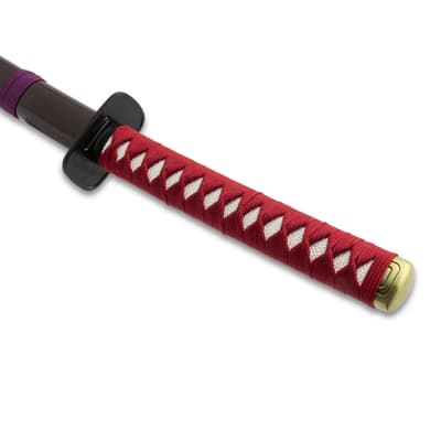 Katana handle with red wrapping and black guard