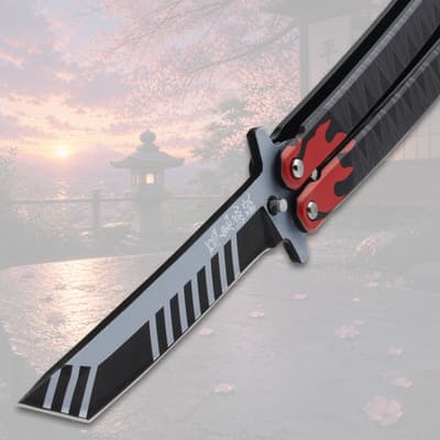 Butterfly knife blade with flame design on a scenic background