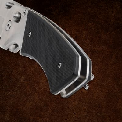 Close-up of black handle on a folding knife