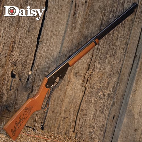 The BB rifle has a hardwood stock with a stained finish and a smooth bore steel barrel with a crossbolt trigger block safety