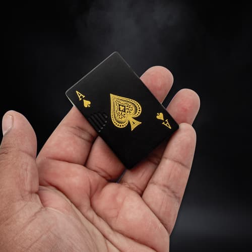 Full image of the Dragon Poker Lighter held in hand.