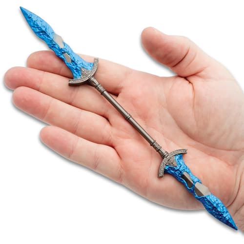 The twinblade laying on a hand.