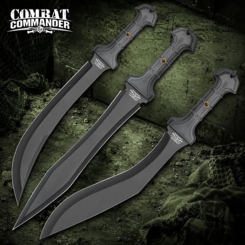 Three black tactical knives with textured handles on a green background