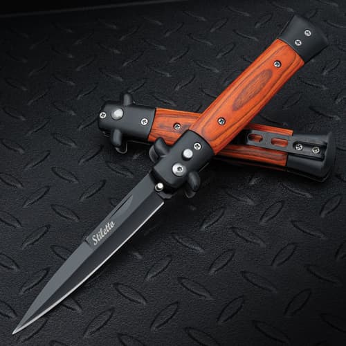 The Gangster's Edge Automatic Stiletto Pocket Knife, with its 3 7/8" black coated stainless steel blade and wood inlaid handle, displayed both opened and closed on a black background.