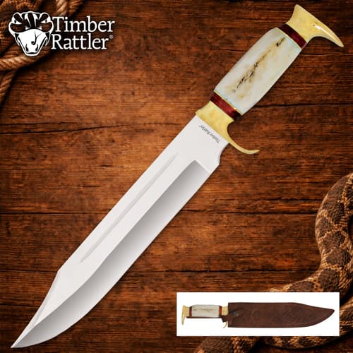Large knife with bone handle on wooden background