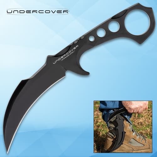 Curved black knife with finger ring and sheath