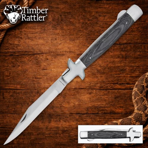 Timber Rattler knife with wooden handle on wood background