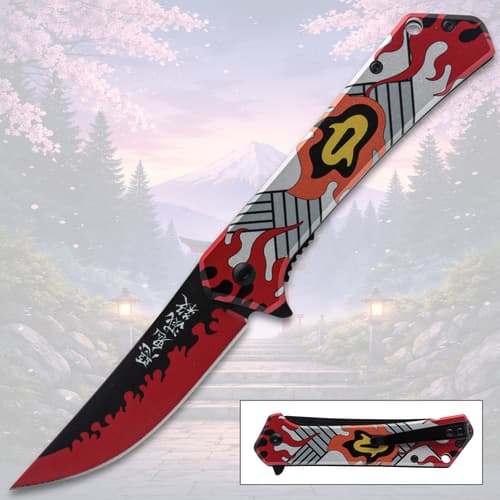 Colorful folding knife with flame design, mountain background
