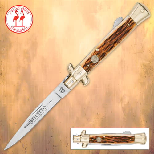 Open Kissing Crane Amber Bone Stiletto Knife with logo and background