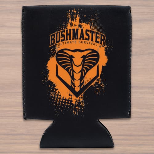 A black koozie is shown printed with an orange paint splatter effect on the Bushmaster logo, which features a snake head image.