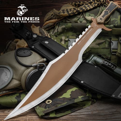 Large USMC knife on camo gear with gas mask