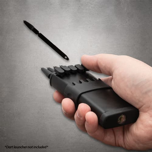Hand holding a black launcher with On Target darts loaded and one dart airborne; launcher not included