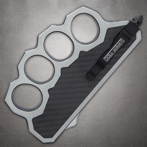 Close-up of knuckle knife with carbon fiber inlay