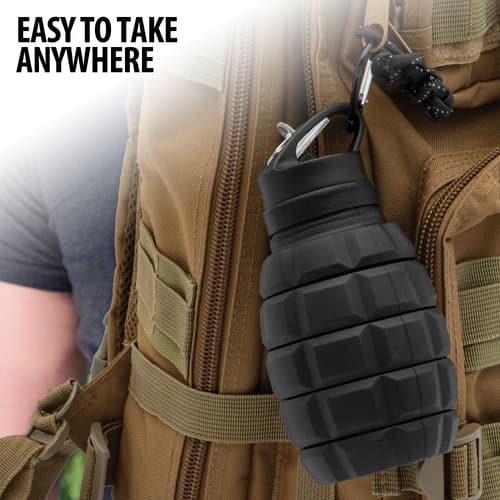 Full image showing the Collapsible Water Bottle attached to a backpack.