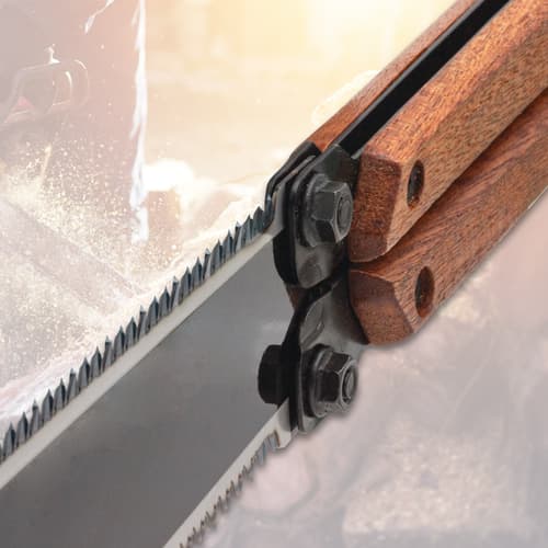 Close-up of folding saw teeth and wooden handle