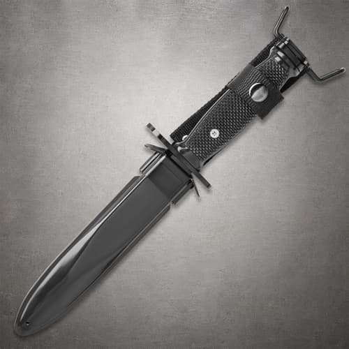 Knife in sheath with textured handle and guard