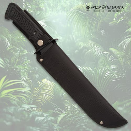 Knife in black sheath against jungle backdrop