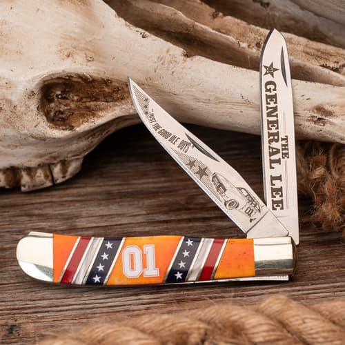 Knife with 'General Lee' engraving, placed on wooden surface