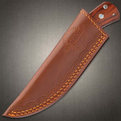 The 7 7/8” overall fixed blade slides securely into a premium leather sheath and the handle has a brass lanyard tube