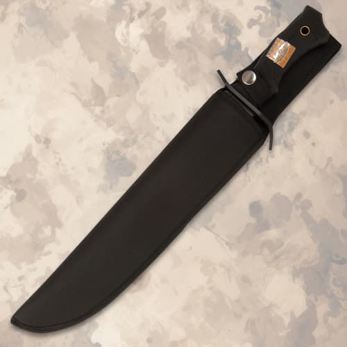 United Cutlery Marine Force Recon Night Stalker Bowie Knife has &ldquo;Night Stalkers Don&rsquo;t Quit&rdquo; down the side of the black blade.