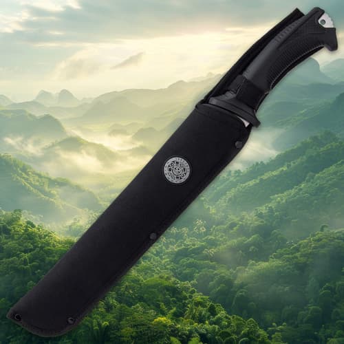 Black machete sheath against misty mountain backdrop