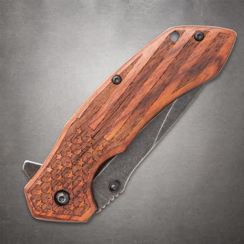 Closed pocket knife highlighting the engraved wooden handle with star and stripe details