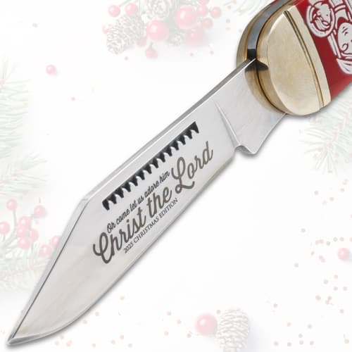Close-up of knife blade with 'Christ the Lord' engraving