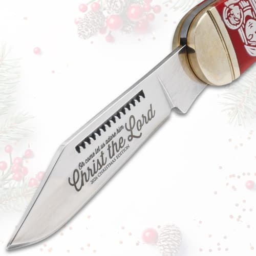 Close-up of knife blade with 'Christ the Lord' engraving