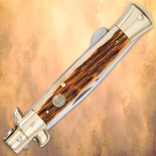 Closed view of Kissing Crane Amber Bone Stiletto Knife handle details