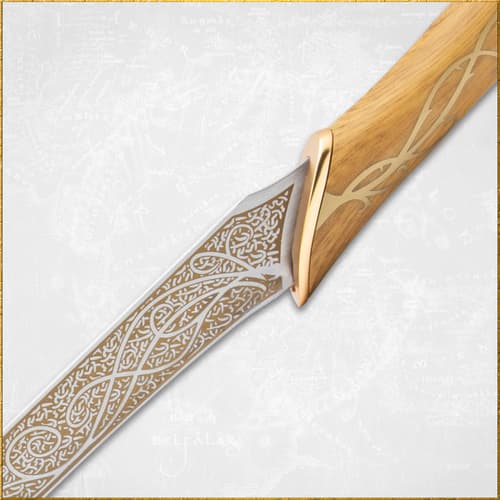 Close-up of a knife blade with detailed engravings