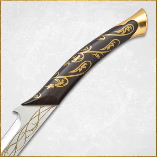 Close-up of sword handle with gold vine design