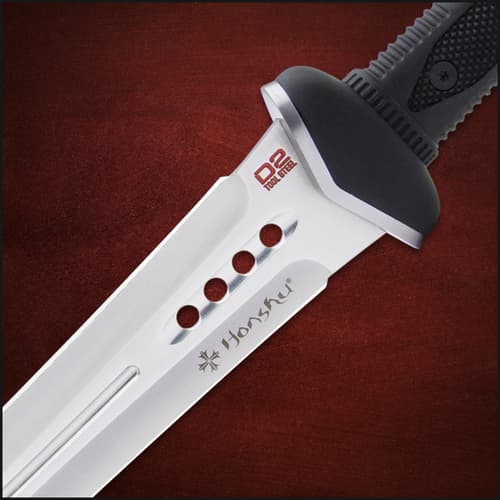 The sword has a keenly sharp, 18 1/4” D2 tool steel blade with a fuller and weight-reducing thru-holes