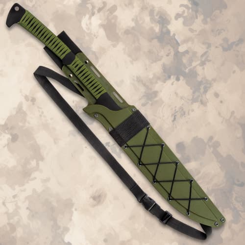 Knife in green sheath with black strap