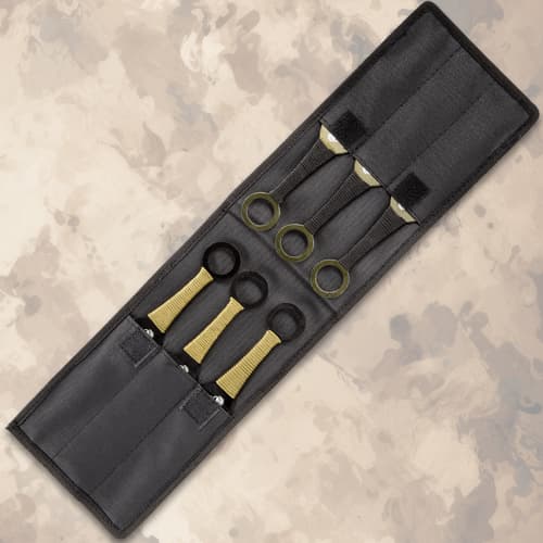Black carrying case holding five throwing knives