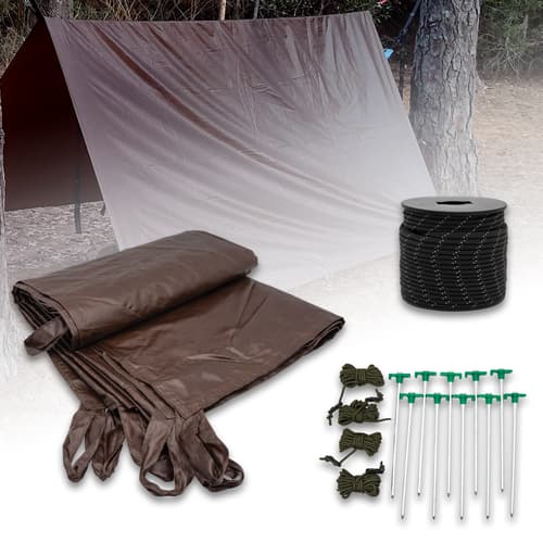 Camping tarp setup with ropes, stakes, and cord