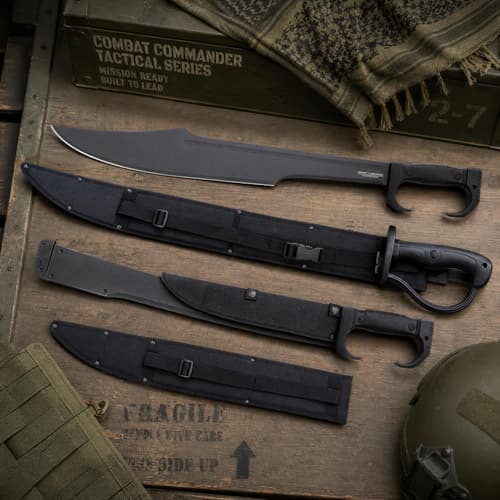 Tactical knives and sheaths on a wooden crate with military gear