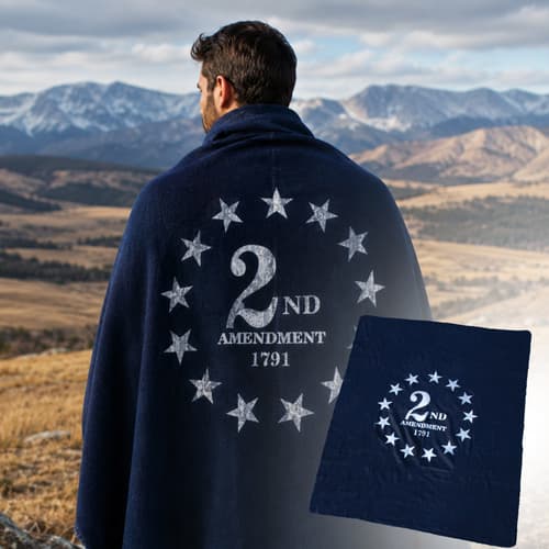Person with blanket featuring '2nd Amendment 1791' design in mountains