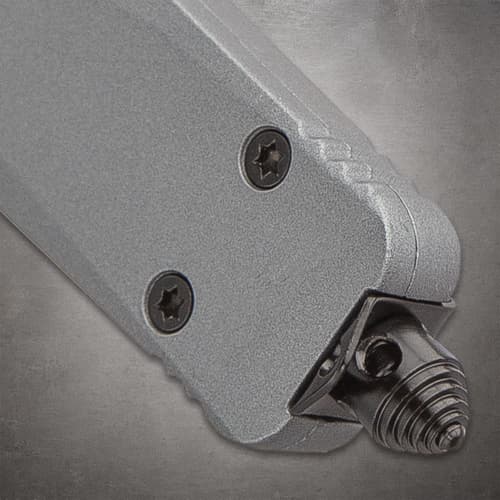 Close-up of tactical knife handle with screws