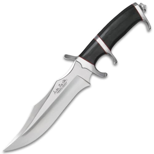 Mirror polished fighter knife with a black micarta handle with red accents and various curved edges.