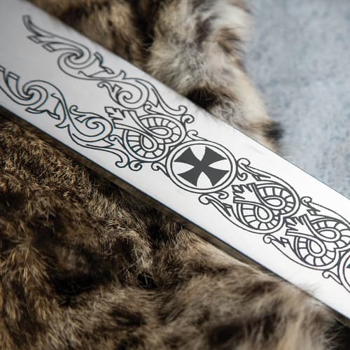 The 36” stainless steel blade has medieval etchings on it.