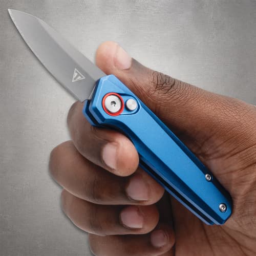Hand holding a blue folding knife