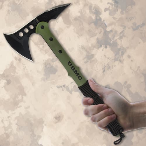 Hand holding a USMC tactical tomahawk