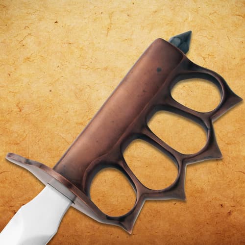 Close-up of brass knuckle handle on trench knife